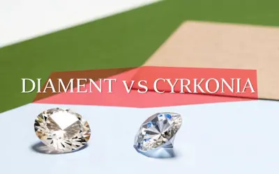 Dwa błyszczące kamienie, jeden przypominający diament, drugi cyrkonię, na tle napisu "DIAMENT VS CYRKONIA". Cyrkon właściwości porównane.