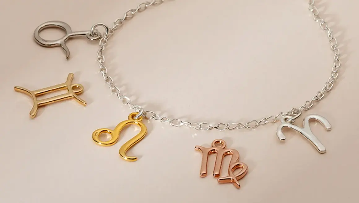 Bransoletka z zawieszkami znaków zodiaku w kolorach złota 585 i srebra.